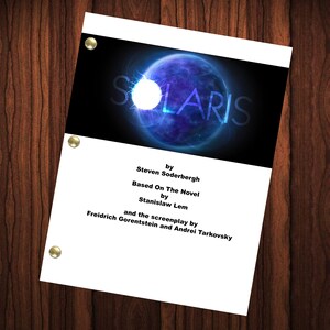 May include: A film poster for the movie Solaris, directed by Steven Soderbergh. The poster features a blue and white planet with a bright white light in the centre. The text on the poster reads "SOLARIS" in large white letters, followed by "by Steven Soderbergh" and "Based On The Novel by Stanislaw Lem" in smaller white letters. The text "and the screenplay by Freidrich Gorentstein and Andrei Tarkovsky" is also included in smaller white letters.