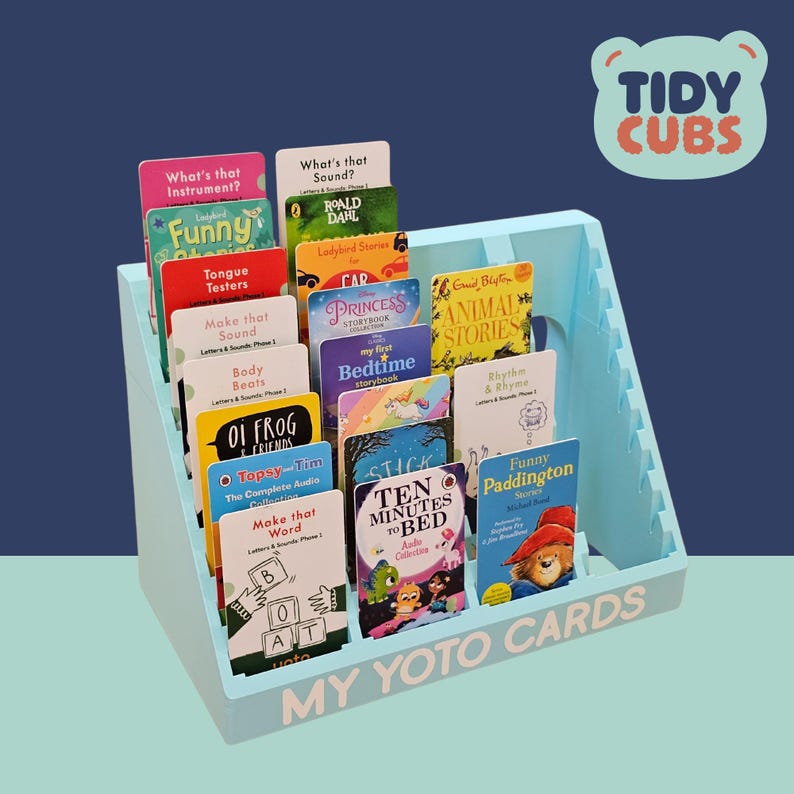 Yoto Card Storage Stand for Audio Cards keeps your little one’s audio story collection tidy with this Yoto card library storage stand, perfectly sized for audio cards like the ones shown in the image.
