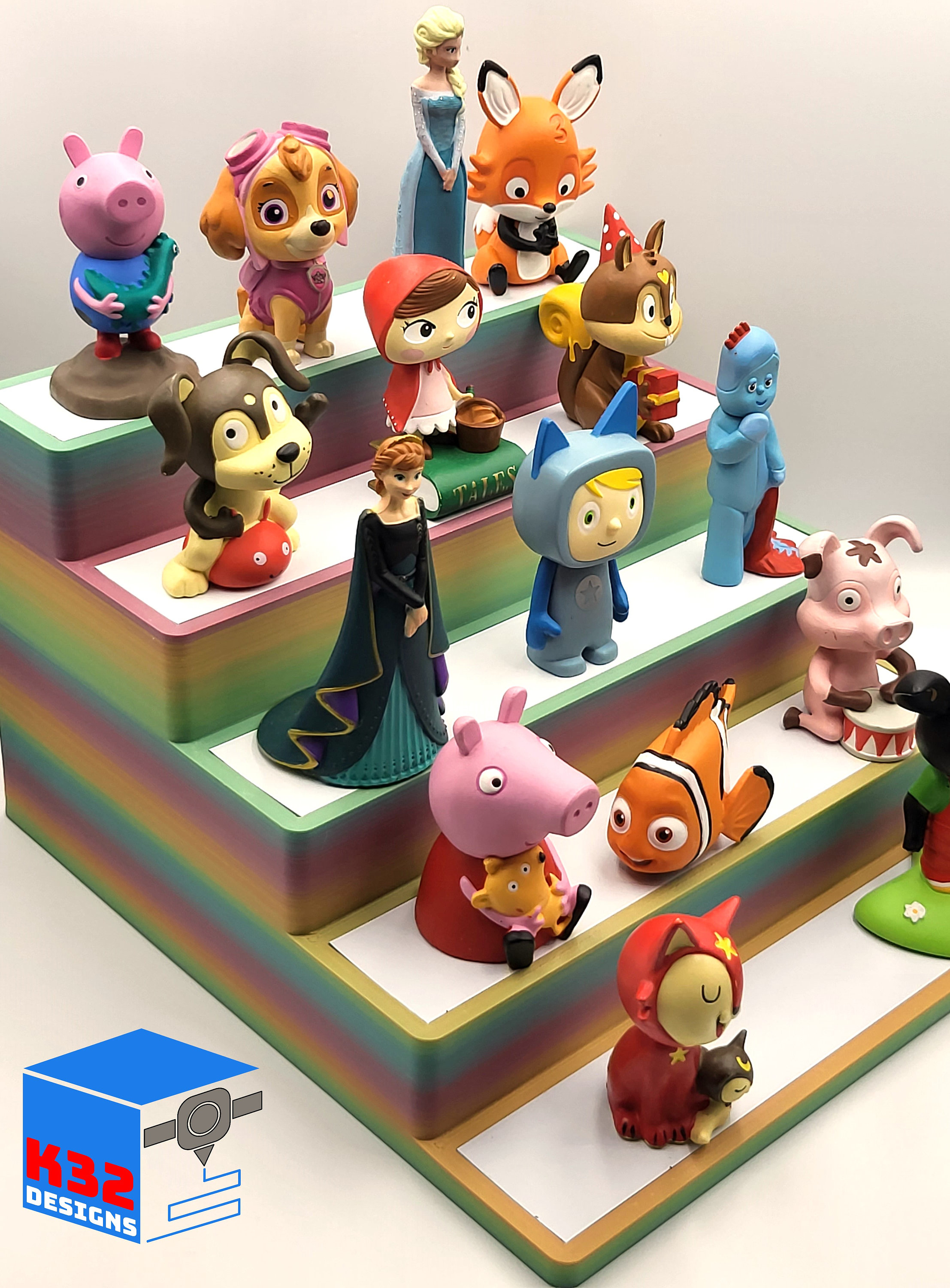 Colorful collection of Tonies figurines displayed on rainbow organizer stand