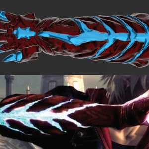 May include: A red and blue claw-like gauntlet, possibly a cosplay prop or a fantasy-themed accessory. The gauntlet features sharp, blue claws and blue accents along the back. The design is detailed and appears to be 3D-modelled.