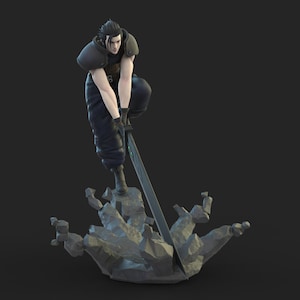 May include: A detailed figurine of a character in a dynamic pose, wielding a large sword. The figure is dressed in dark clothing with shoulder armor, standing atop a rocky base. The overall color palette is muted, with a focus on the character and action.
