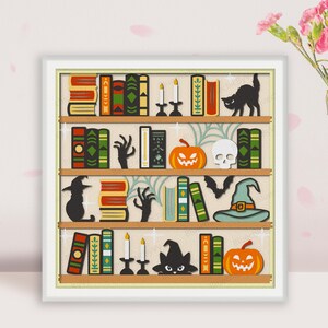 May include: A white bookshelf with five shelves filled with books, pumpkins, candles, and Halloween decorations. The shelves are decorated with black cats, bats, and skulls. The books are all different colors and sizes.