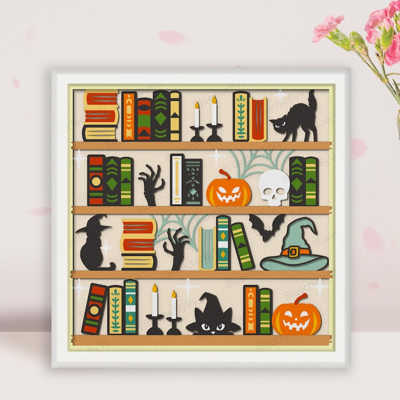 May include: A white bookshelf with five shelves filled with books, pumpkins, candles, and Halloween decorations. The shelves are decorated with black cats, bats, and skulls. The books are all different colors and sizes.