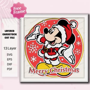 May include: A layered cardstock cut file featuring Mickey Mouse in a Santa suit, with the text "Merry Christmas." The design includes snowflakes and is set against a red and yellow circular background. The image also includes the text "Free Frame."