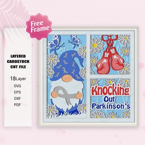 May include: A layered cardstock cut file featuring a blue gnome holding a gray ribbon, surrounded by white daisies and butterflies. The gnome is wearing a blue hat with a gray ribbon. The text "Knocking Out Parkinson's" is displayed in a white banner.