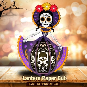 May include: A paper cut lantern featuring a skeletal figure with a white skull face, black eye sockets, and a purple dress adorned with orange and purple floral patterns. The skirt displays intricate cut-out skull and flower designs.