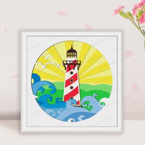 May include: A framed, layered paper art piece featuring a lighthouse with red and white stripes, set against a yellow sunburst. Blue waves and green land are at the base, with white seagulls in the sky. The artwork is in a white frame.