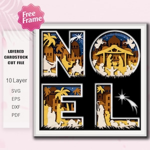 May include: A layered cardstock cut file design spelling "NOEL" with a nativity scene. The design features a 10-layer construction with silhouettes of palm trees, buildings, and figures in shades of yellow, brown, and white against a black background.