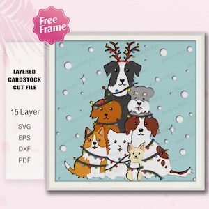 May include: A layered cardstock cut file featuring a Christmas tree design made of various dog breeds. The dogs are decorated with Christmas lights and a reindeer antler headband. The background is light blue with white circles and stars.