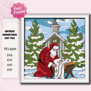 Può includere: Un file di taglio di cartoncino a strati con una scena natalizia con Babbo Natale in ginocchio accanto a una mangiatoia. L'opera d'arte include una chiesa, alberi sempreverdi e neve che cade, il tutto all'interno di una cornice bianca.