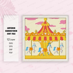 May include: A 12-layer papercraft carousel with a yellow and red roof, white horses, and a blue sky background. The carousel is ready to be cut out and assembled.