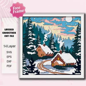 Könnte beinhalten: Ein gerahmtes, mehrschichtiges Karton-Schnittmuster mit einer Winterlandschaft, die zwei schneebedeckte Häuser, eine gewundene Straße und Tannenbäume zeigt. Das Kunstwerk enthält Text, der darauf hinweist, dass es sich um ein 14-Schichten-Design mit SVG-, EPS-, DXF- und PDF-Dateiformaten handelt.