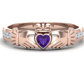 May include: A rose gold Celtic knot ring with a purple heart-shaped gemstone and a row of clear diamonds on each side.