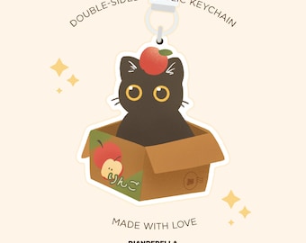 Czarny, słodki kotek w pudełku z jabłkami, akrylowy brelok - uroczy urok Kawaii Kitty