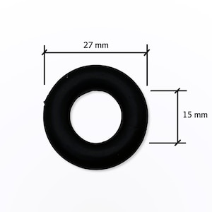 May include: A black rubber O-ring with a 27 mm outer diameter and a 15 mm inner diameter.