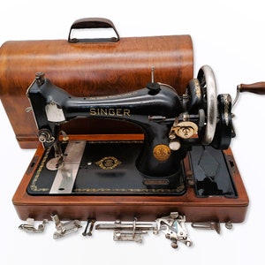 Singer Model 128 Hand Crank Sewing Machine from 1937 with Accessories and Wooden Cover image 1