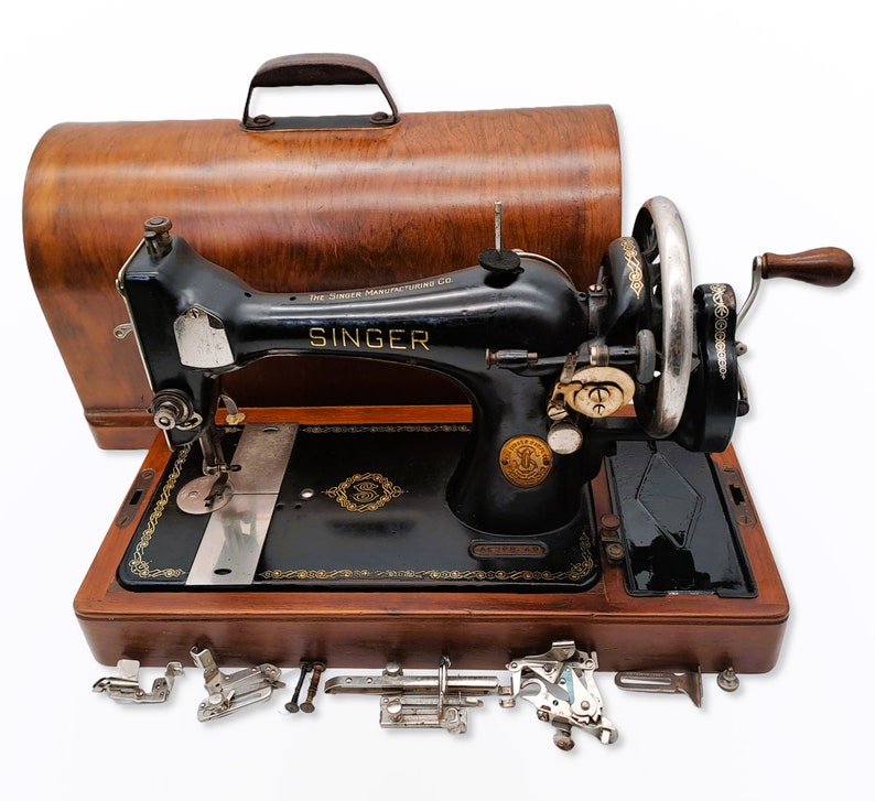 Singer Model 128 Hand Crank Sewing Machine from 1937 with Accessories and Wooden Cover image 1