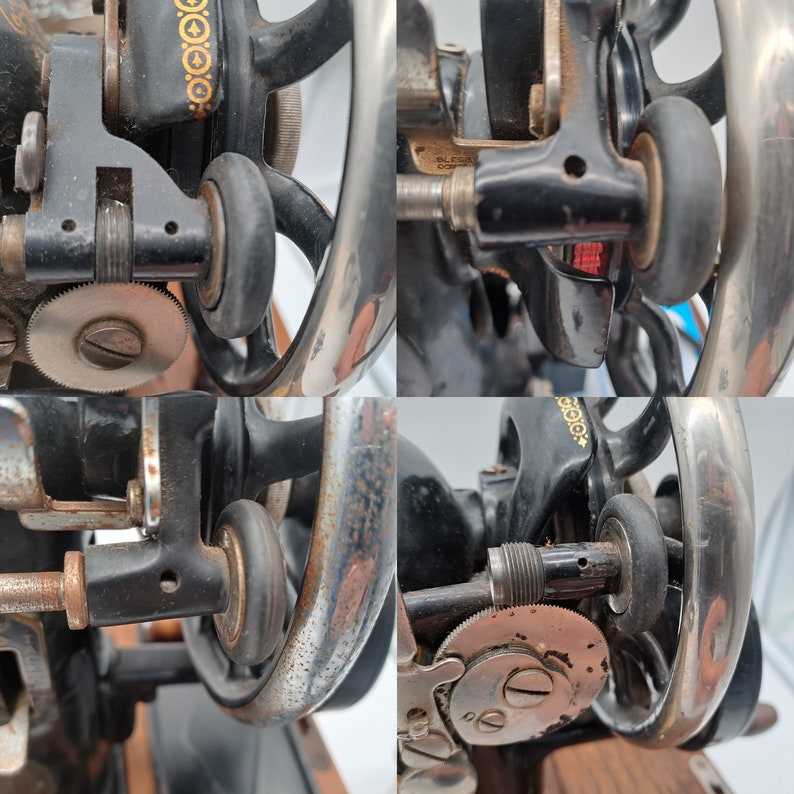 May include: Close-up of a vintage sewing machine with black and silver metal parts. The machine has a large, round, silver-coloured wheel with a black band around the edge. There are several smaller wheels and gears visible. The machine is in good condition and appears to be well-used.