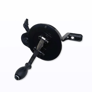 May include: A black hand-cranked mechanism with a circular base, a handle, and a lever. The handle is rounded and black, and the lever is silver. The mechanism appears to be made of metal and plastic.
