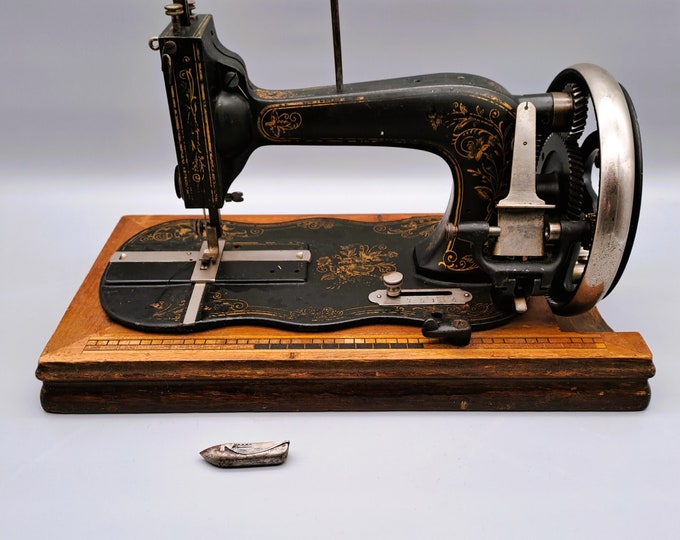 Crank Sewing Machine From the 1800s With a Violinshaped Base, to Be