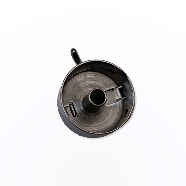 May include: Black metal sewing machine bobbin winder with a small hook on the top.