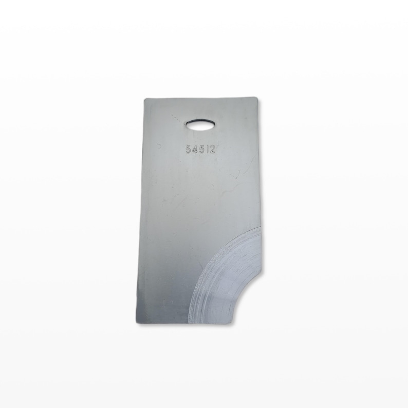 May include: A silver-coloured metal tag, rectangular with a curved cutout and an oval hole at the top. The number "54512" is etched near the top. The surface shows scratches and wear.