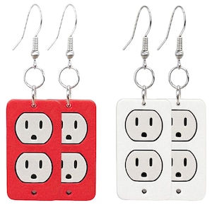 May include: A pair of novelty earrings featuring a red and a white electrical outlet design. Each earring has a rectangular shape with four outlet graphics and silver-colored fish hook ear wires.