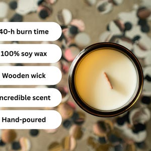 May include: Overhead view of a candle in a glass jar. The candle has a wooden wick and is filled with white wax. Text on the left indicates the candle has a 40-hour burn time, is made of 100% soy wax, and is hand-poured.