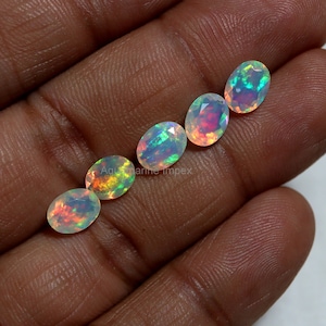 8x6 MM Natural AAAA Rainbow Flashy Fire White Ethiopian Opal Faceted Oval Gemstones, 6x8 MM Top Green Red Yellow Blue Color Play Real Opal