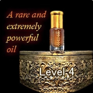 May include: A small, clear glass bottle with a gold cap, filled with a dark amber liquid, sits atop an ornate, gold-colored box. The text "A rare and extremely powerful oil" is displayed in gold lettering. The box has the text "Level 4".