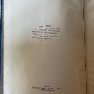 May include: Open book with text: "THIS BOOK" and details about a limited edition published by the Twenty-Fifth Infantry, United States Army. The Smith-Brooks Printing Company is listed with an address in Denver, Colorado.