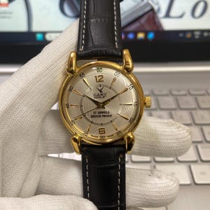 Orologio da polso da uomo Camy meccanico vintage ricondizionato a carica manuale con 17 rubini, quadrante argentato e cinturino nero, RM14