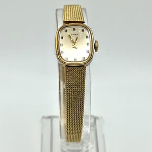 Vintage 1960s Timex Ladies Watch: Gold Tone Petite Mechanical Dress Watch