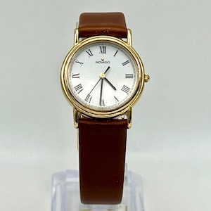 Vintage Classic Movado Swiss  Gold case White Roman Dial Ladies Watch Working