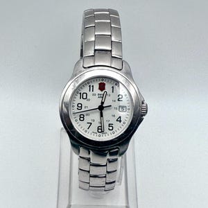 Vintage Victorinox Swiss Army Woman&#39;s Officers Round Silver White tones Watch Working
