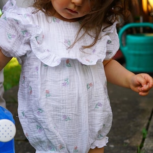 Ruffled jumpsuit with short puff sleeves made of embroidered muslin in many colors for babies and toddlers