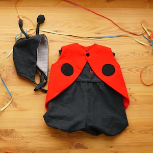 Linen and muslin ladybug costume for babies and toddlers with antennae wings and hand-embroidered bubble