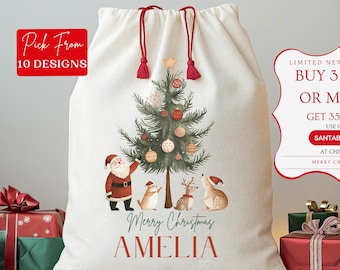 May include: A personalized white canvas Christmas gift bag with a red drawstring and a festive illustration of a Christmas tree, Santa Claus, and woodland animals. The bag is decorated with the text "Merry Christmas Amelia" and "Personalized".