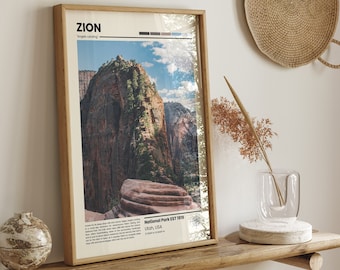 May include: A framed poster with a minimalist design featuring a photograph of a mountain range in Zion National Park, Utah. The poster includes the text "ZION" and "Angels Landing" in a sans-serif font. The text "National Park EST 1919" is also included, along with the location "Utah, USA".