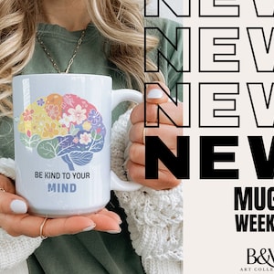 Pode incluir: Caneca de cer&acirc;mica branca com um design de c&eacute;rebro colorido e o texto "Be Kind to Your Mind".