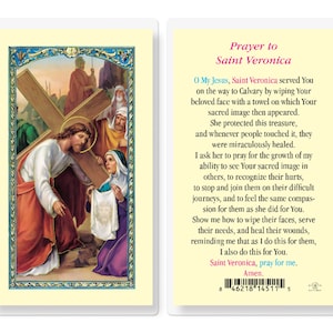 May include: A religious prayer card featuring a painting of Jesus carrying the cross with Saint Veronica kneeling and offering a cloth to wipe his face. The text on the card reads "Prayer to Saint Veronica" and includes a prayer to Saint Veronica.