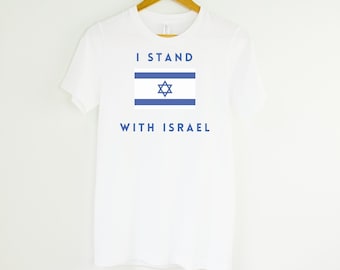 May include: White t-shirt with blue text that reads "I Stand With Israel" and a blue image of the Israeli flag.