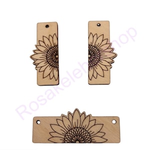 May include: Three unfinished wooden rectangular shapes with a laser-etched sunflower design. The shapes are ready to be painted or stained.