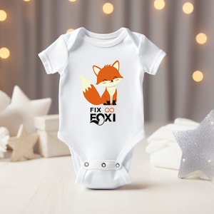 May include: White baby onesie with a cute orange fox illustration and the text "Fix ∞ Foxy".
