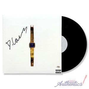 May include: A white album cover with a gold wristwatch and a signature. The album is next to a black vinyl record. The watch has a blue square face. The album cover has a Parental Advisory sticker.