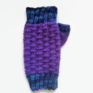 May include: Purple and blue fingerless gloves with a textured knit pattern.