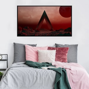 Puede incluir: Una impresión de arte abstracto enmarcada con un marco negro. La impresión presenta un gran triángulo negro en el centro con un fondo rojo y naranja. Un planeta rojo es visible en la esquina superior derecha de la impresión.