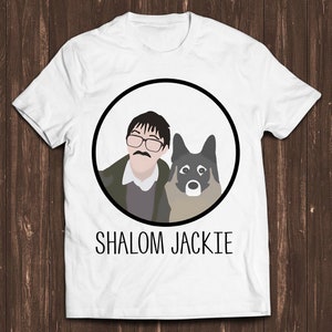 May include: White t-shirt with a black circle containing a cartoon illustration of a man with glasses and a mustache and a dog. The text "SHALOM JACKIE" is printed below the circle.