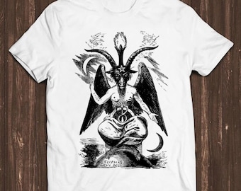 May include: A white short-sleeved t-shirt featuring a black and white graphic print of the Baphomet figure with wings, horns, and a pentagram on its forehead. The illustration includes crescent moons and the text Eliphas Levi Del at the bottom.