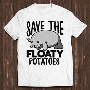 May include: White t-shirt with a cartoon manatee and the text "Save the Floaty Potatoes".